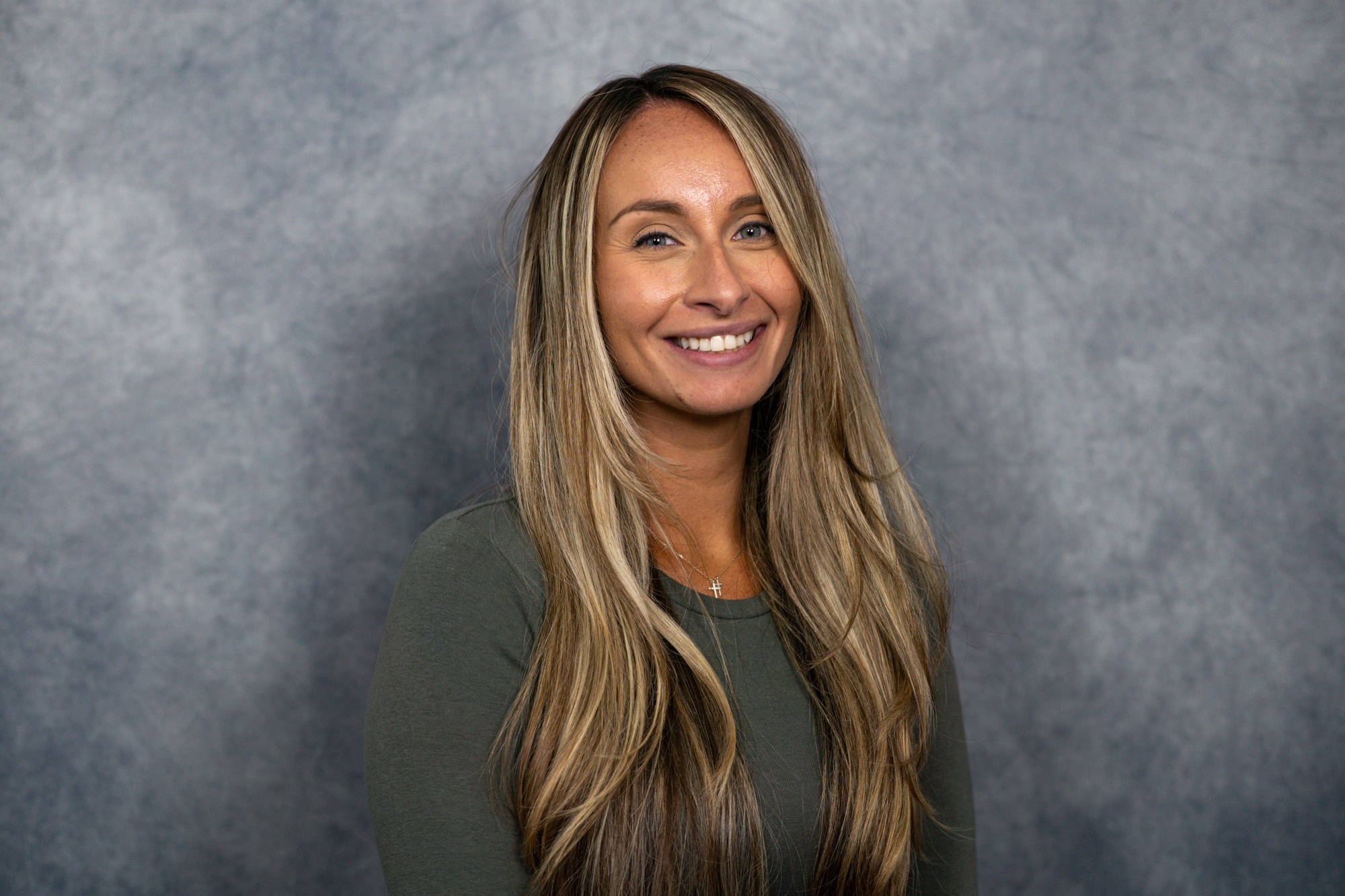 A finished professional headshot in the delivered content library