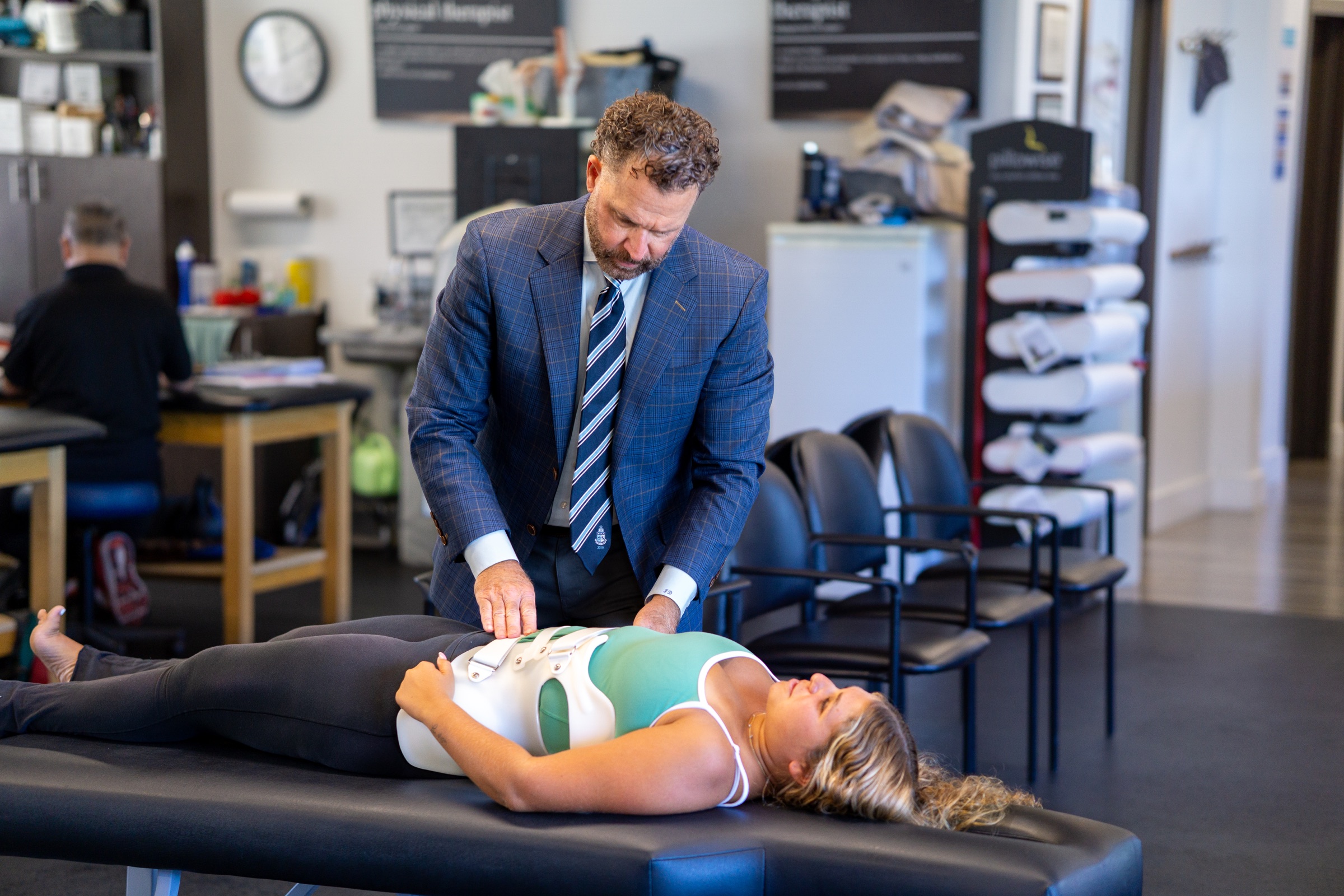Scoliosis specialist providing hands-on brace treatment